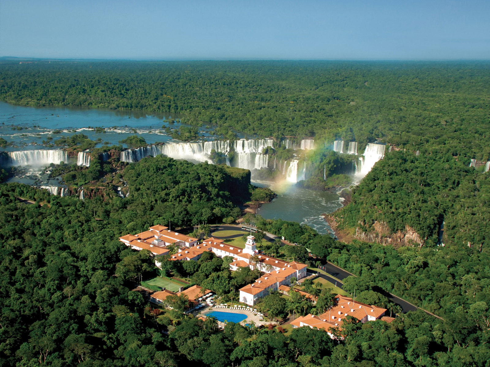 Belmond Hotel das Cataratas — aerial view of the pink Portuguese colonial hotel facing Iguazu Falls